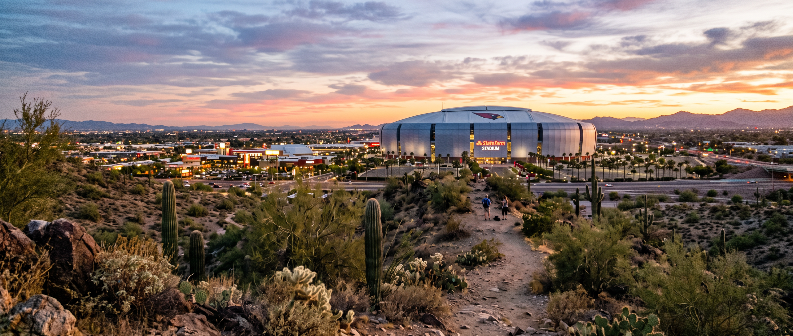 Sunset over Glendale with the stadium on the horizon and saguaros in the foreground